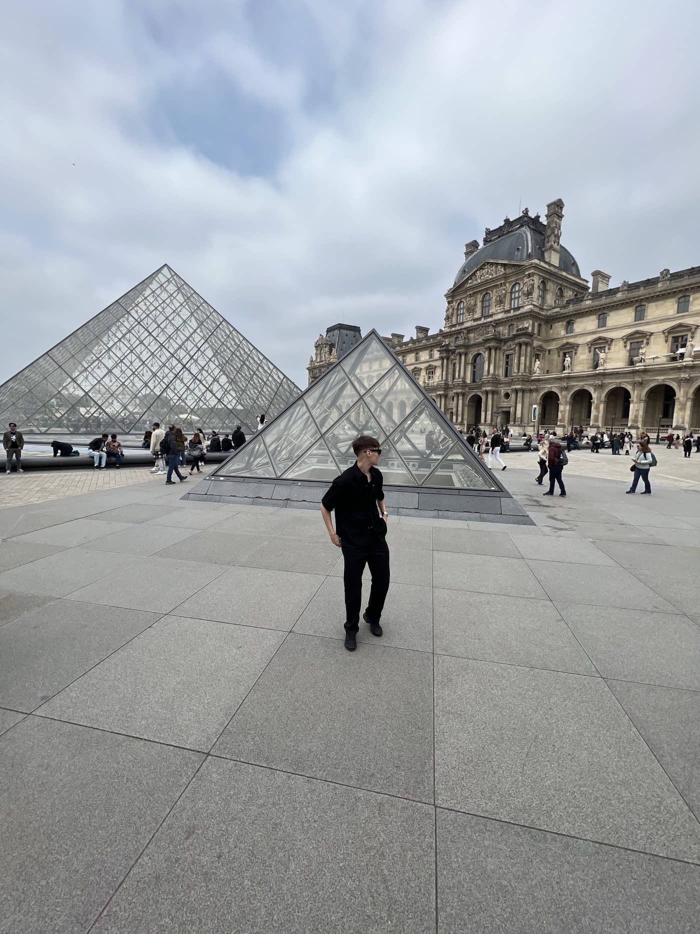 Lucas in the courtyard of the Louvre