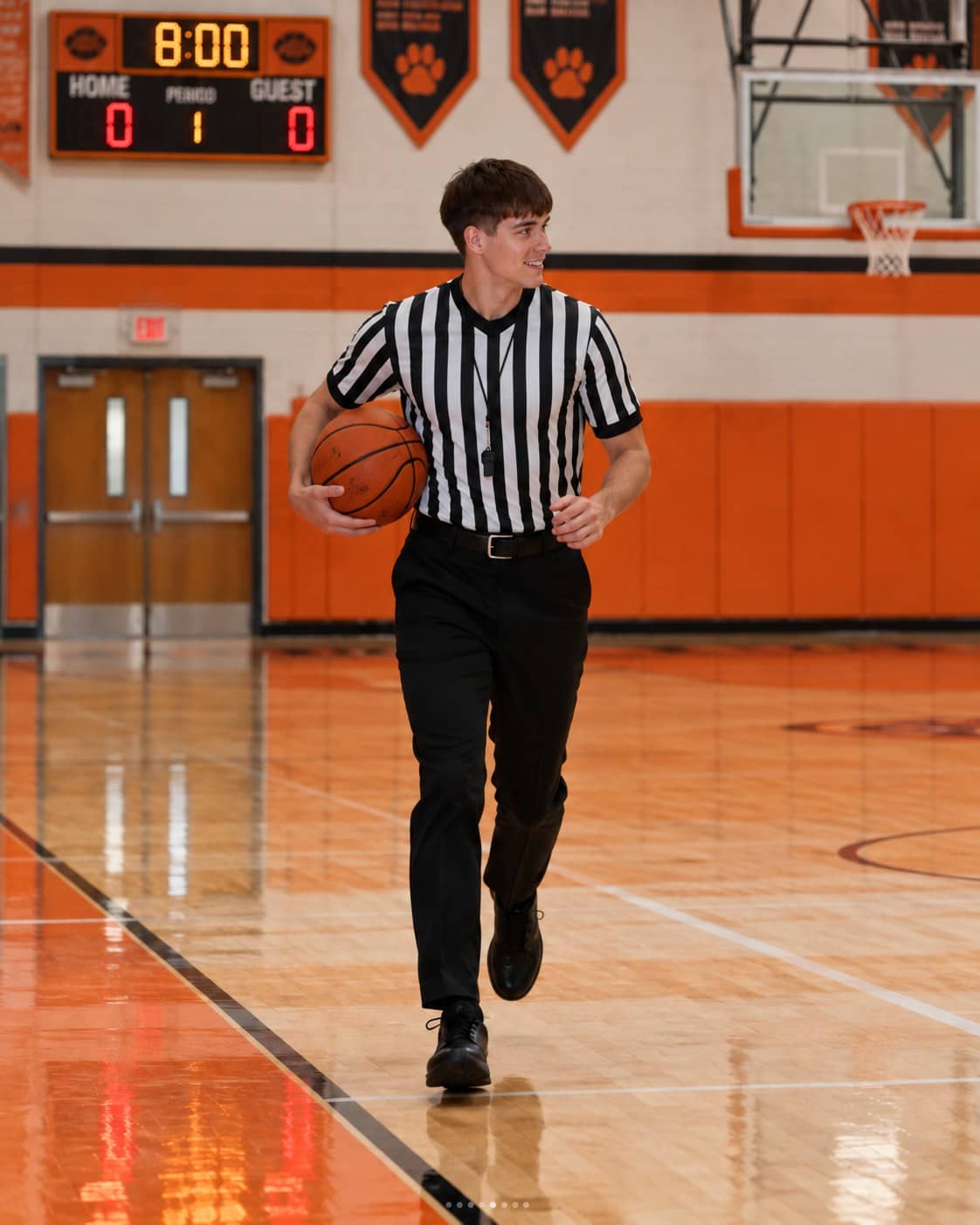 Lucas refereeing a basketball game